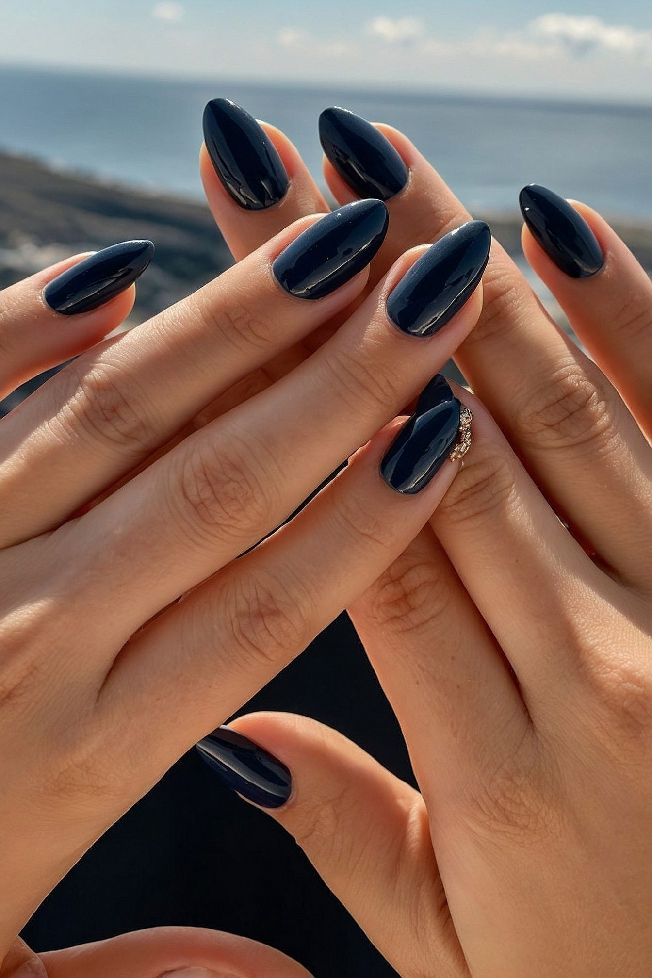 Glossy Midnight Nails Against a Distant Ocean Vista