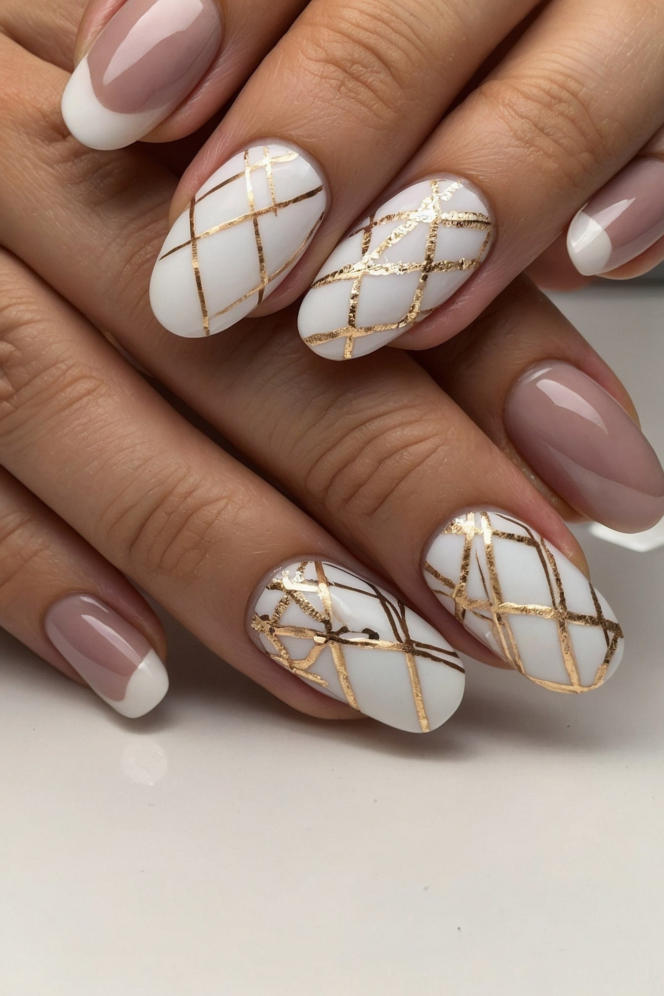 Close-up of Almond Nails with Gold Lattice Art