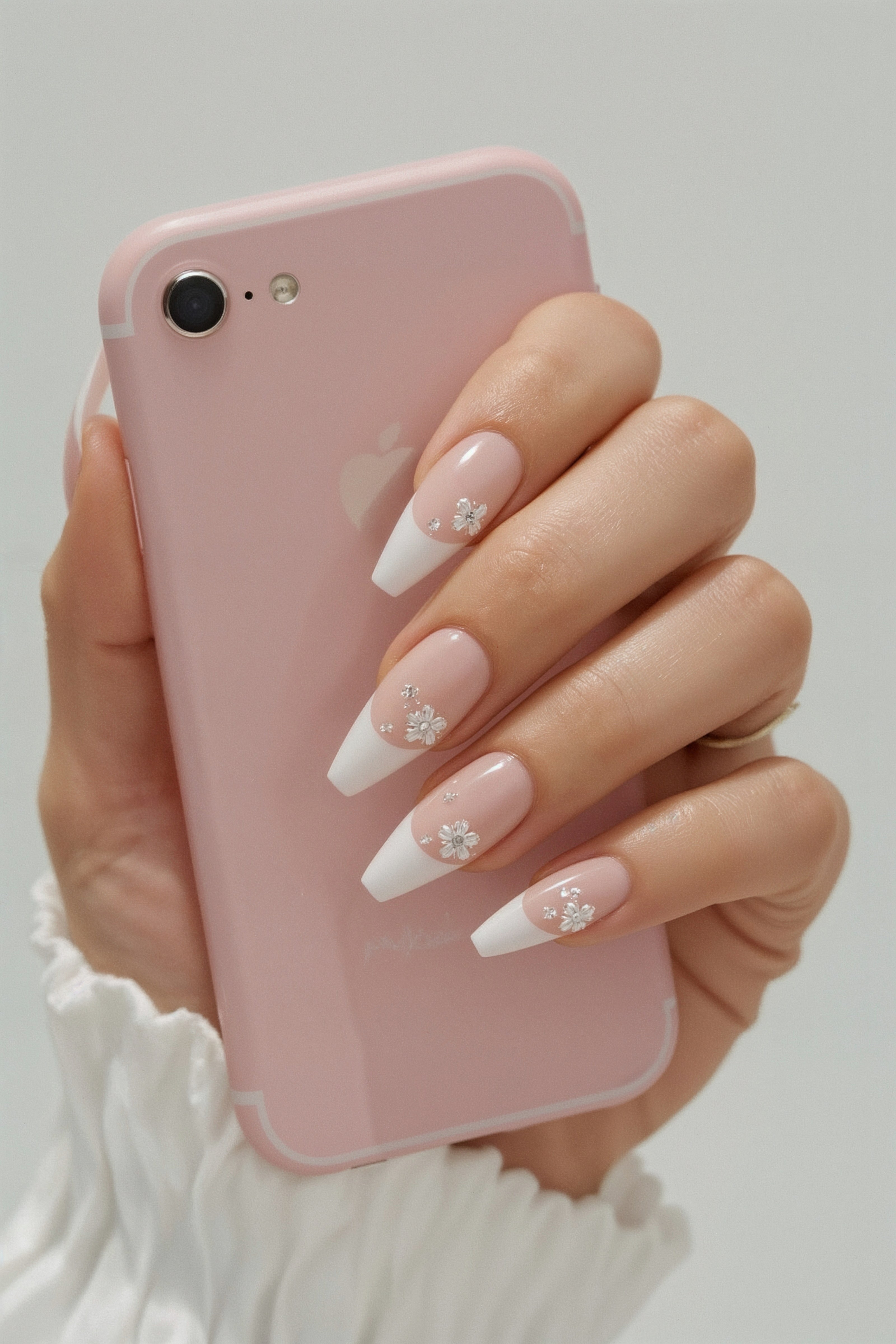 Soft Pink French Tips with Floral Accents