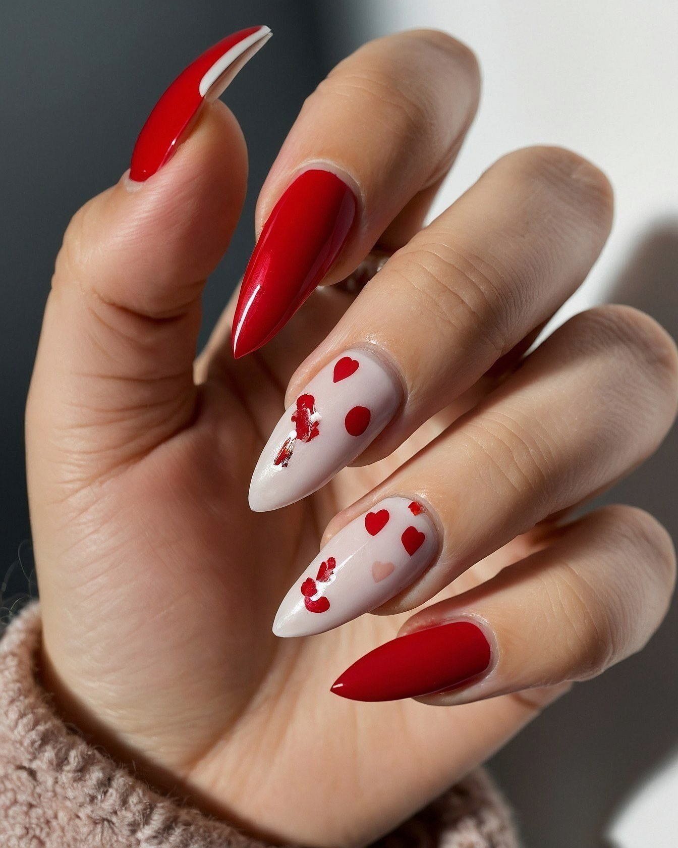 Bold Red Stiletto Tips with Subtle Heart Accents