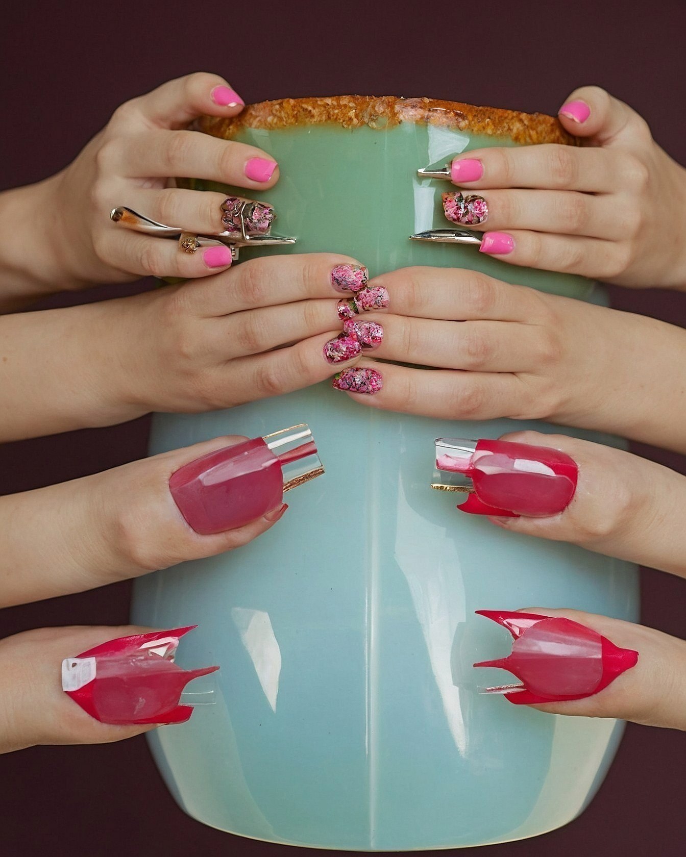 How do multiple distinct nail art styles create visual intrigue?