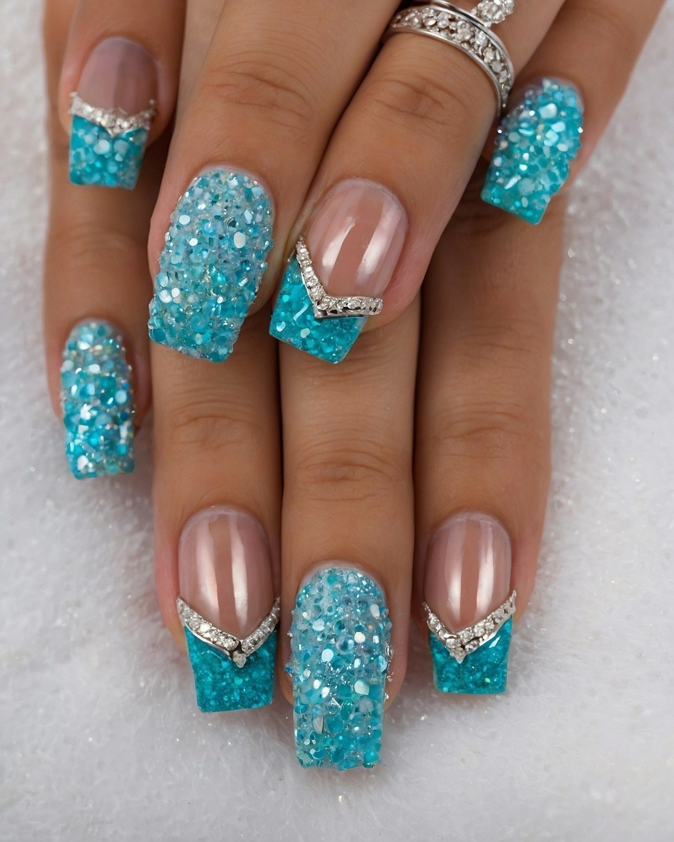 Close-up of Glittering Ocean Blue and Taupe Nails