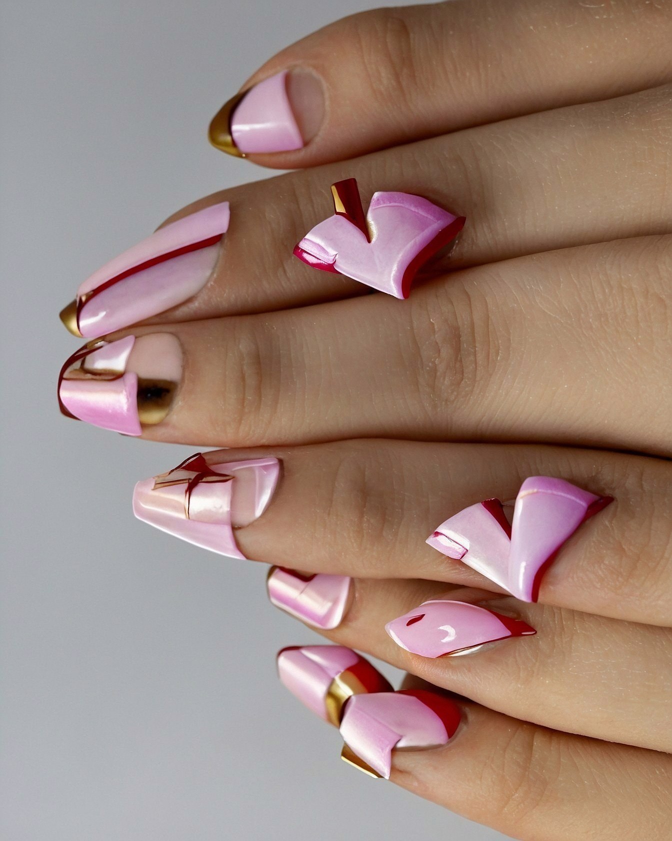 Soft pink and metallic gold French tips