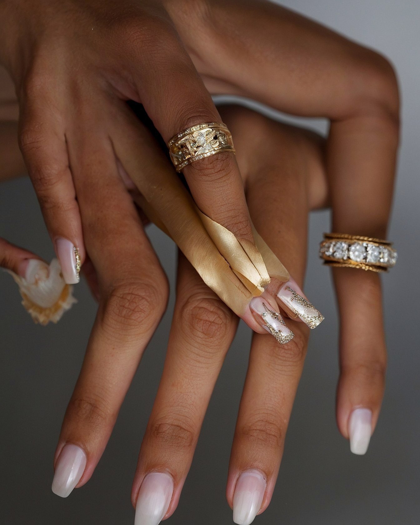 Soft Almond Nails Contrasting with Glitter Accents
