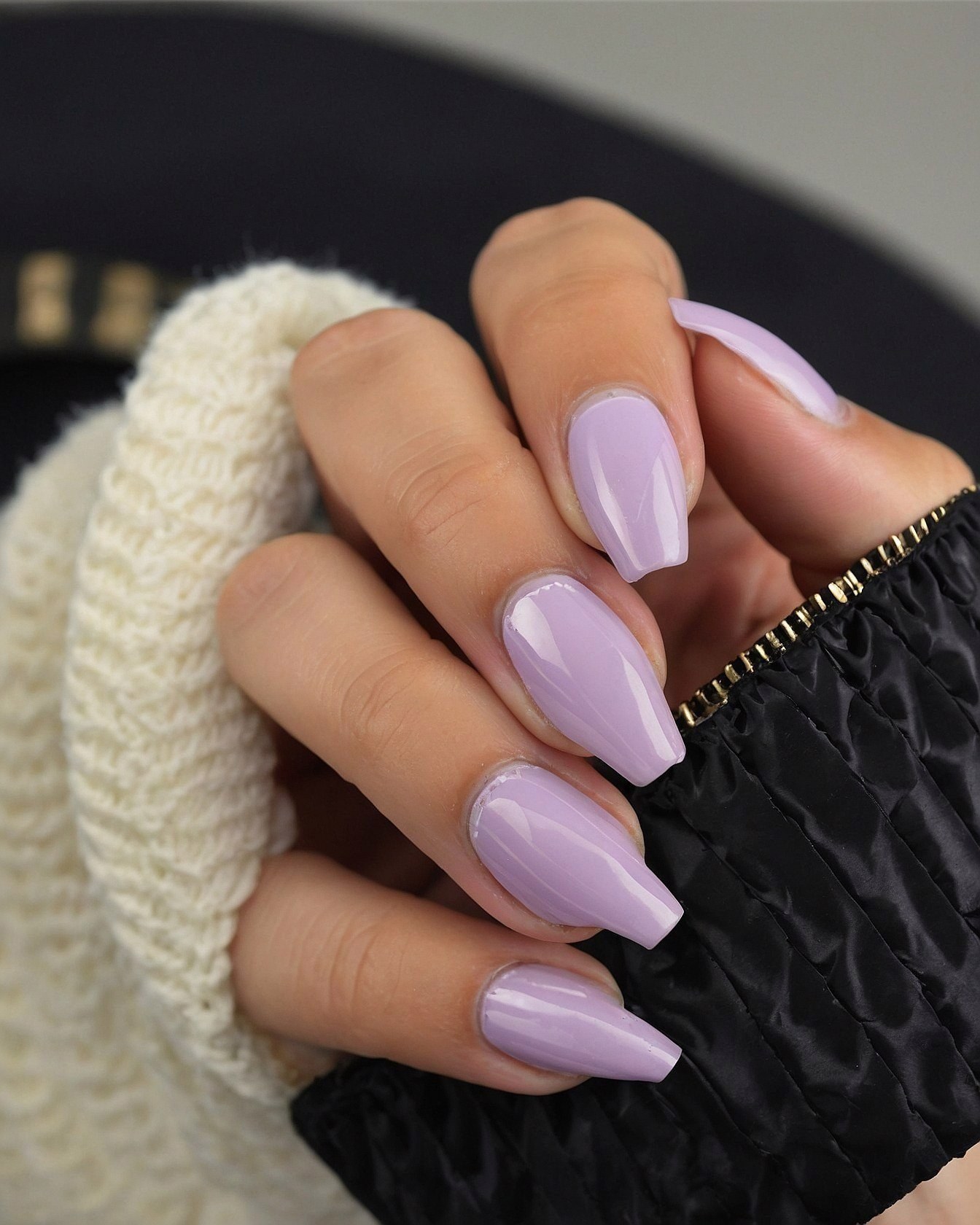 Soft Lavender Coffin Nails Against Cozy Knit