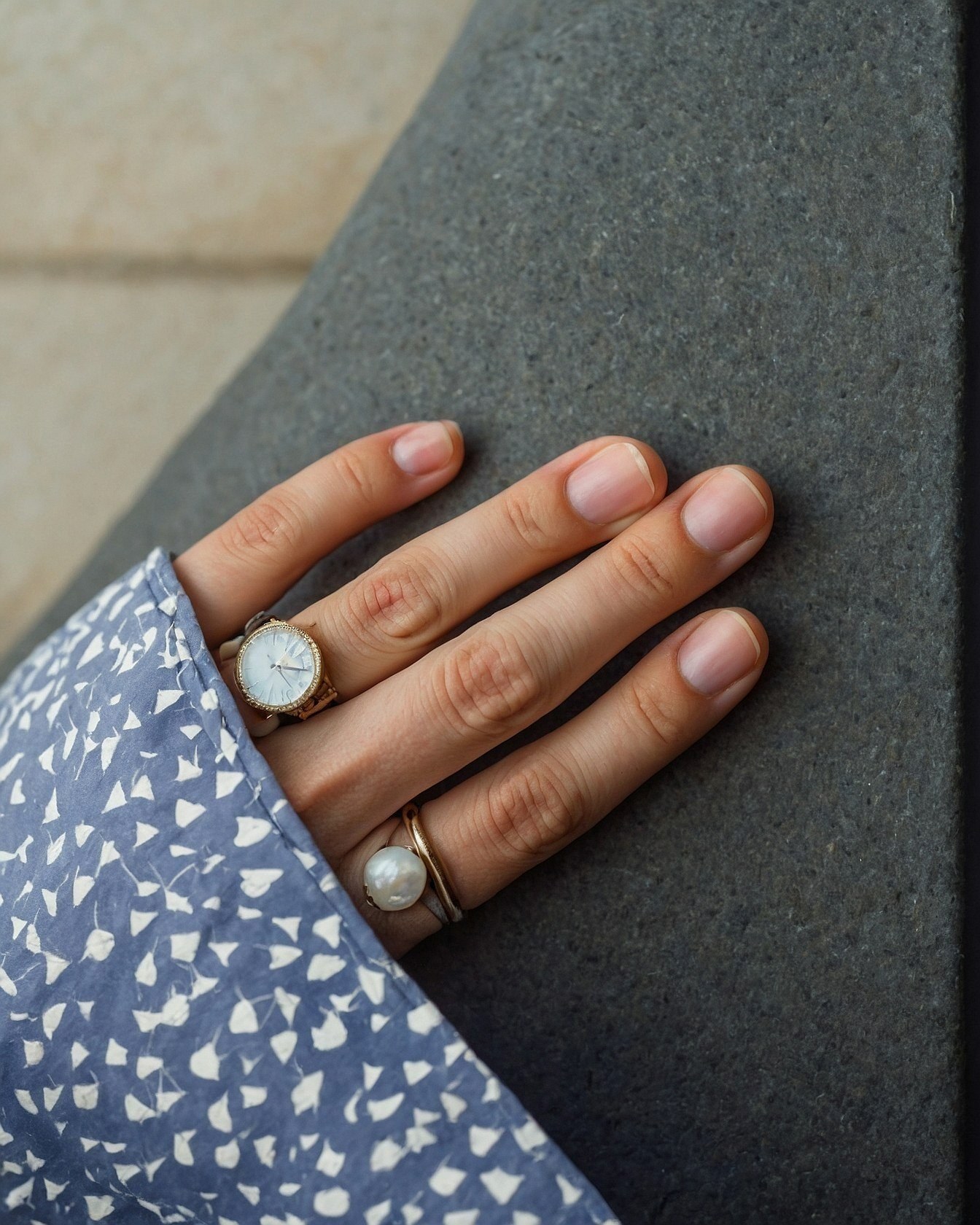 A Hand with Minimalist Jewelry and Natural Nails