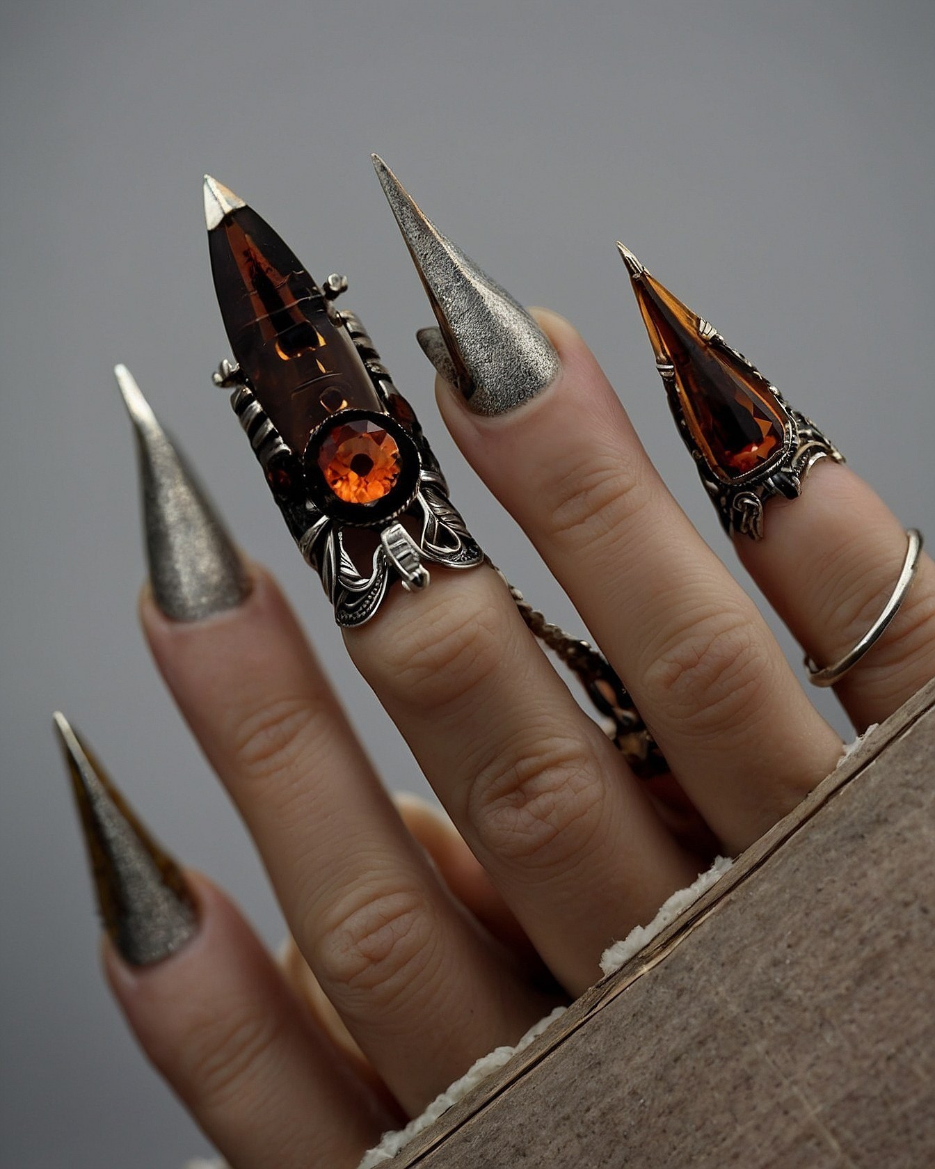 Gothic Glamour: Stiletto Nails Paired with Statement Rings