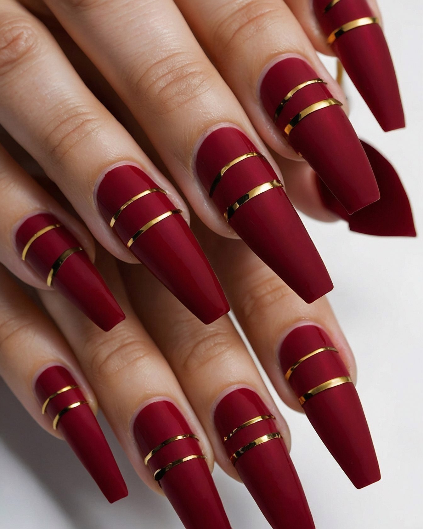 Bold Matte Red Coffin Nails with Gleaming Gold Bands