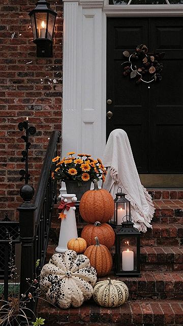 Decorating Porch Steps With Sheet Ghosts And Pumpkins