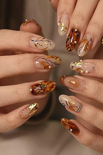 Autumn Amber Nails With Delicate Gold Leaf Accents