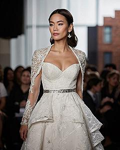A Structured Look with Sheer Lace Sleeves and Capelet