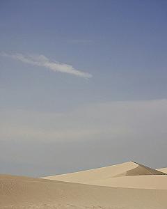 Minimalist Sand Dunes Beneath a Pale Dusky Horizon