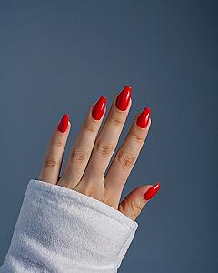 Vibrant Red Acrylic Nails With A Glossy Finish