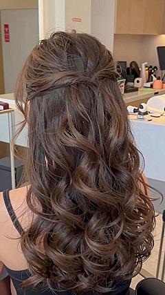 Creating a Soft Knotted Half Up Half Down Style
