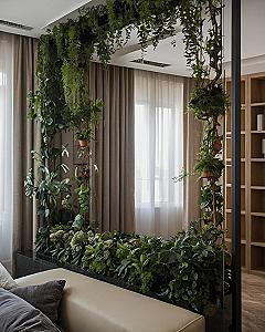 Hanging green vines framing a soft taupe and ivory interior