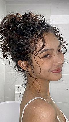 Securing a High Top Knot Bun for Long Hair