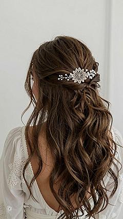 Securing a Statement Floral Hair Comb in Wavy Dark Tresses