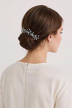 Bridal Hair Trends: Elegant Low Updo with Pearl Accessories