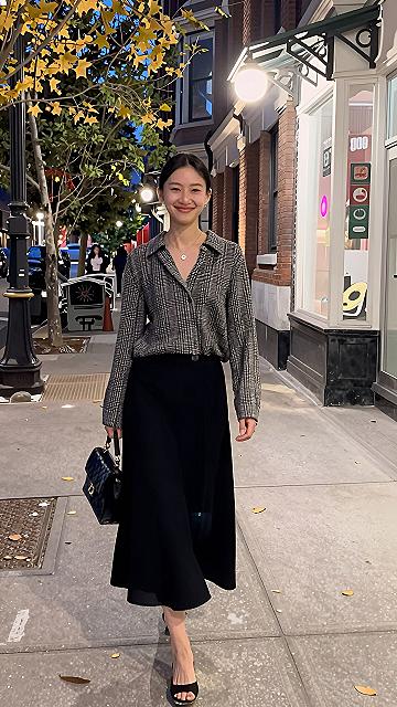 Pairing a Patterned Tweed Jacket With a Simple Black Skirt