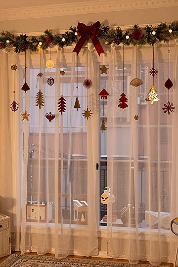 Hanging Paper Ornaments from Curtain Rods