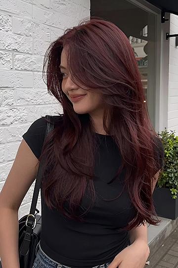 Rich Burgundy Tones on Layered Brown Hair