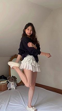 Pairing Oversized Sweaters with Ruffled Skirts for Fall