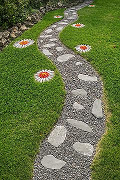 DIY Garden Path: Whimsical Stone Walkway with Painted Flowers