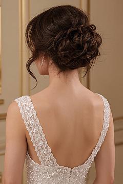 Sophisticated High Bun Wedding Hairstyle: Intricate Updo Design