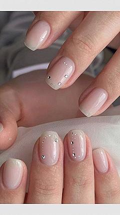 Applying Tiny Gem Accents on Milky White Nails