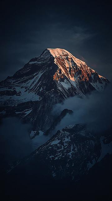 Dramatic 4K Mountain Peak: Moody iPhone Lock Screen Wallpaper