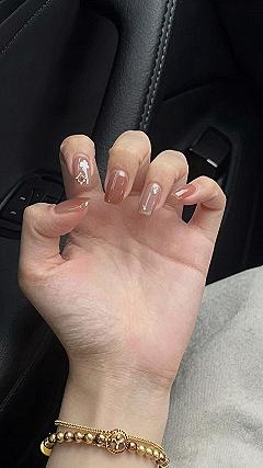 Applying Minimalist Rhinestone Accents on Warm Latte Nails