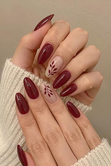 Minimalist Burgundy Leaf Accents on Almond Nails