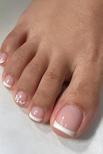 Adding Delicate White Floral Accents to a Classic French Pedicure