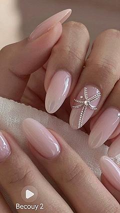 Adding Sparkle with Rhinestone Accents on Pink Nails
