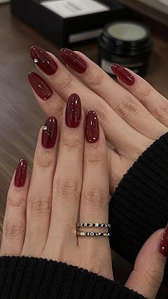 Adding Subtle Rhinestones to Burgundy Almond Nails