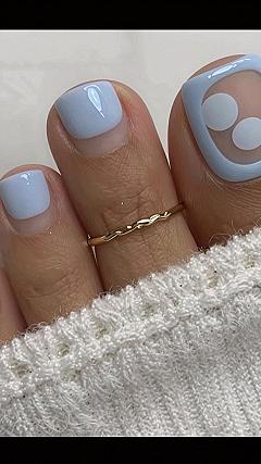 Charming Polka Dot Patterns on Soft Blue Pedicures