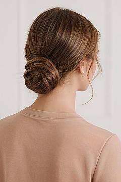 Chic Wrapped Low Bun: Elegant Bridal Updo for Guests