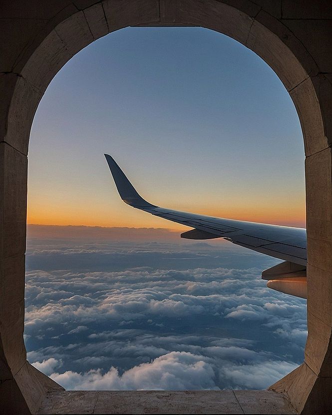 Framing the sky through an architectural stone window archway