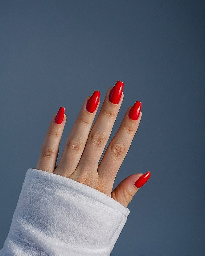 Vibrant Red Acrylic Nails With A Glossy Finish