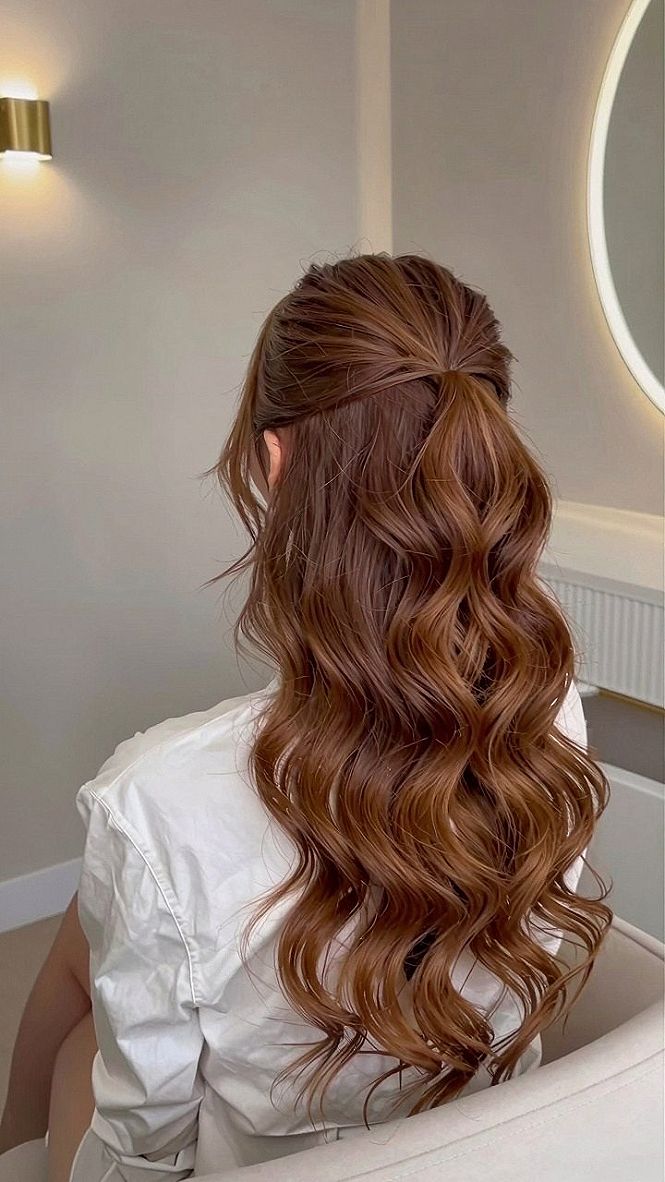 Loose Waves And Voluminous Half Up Ponytail Styles