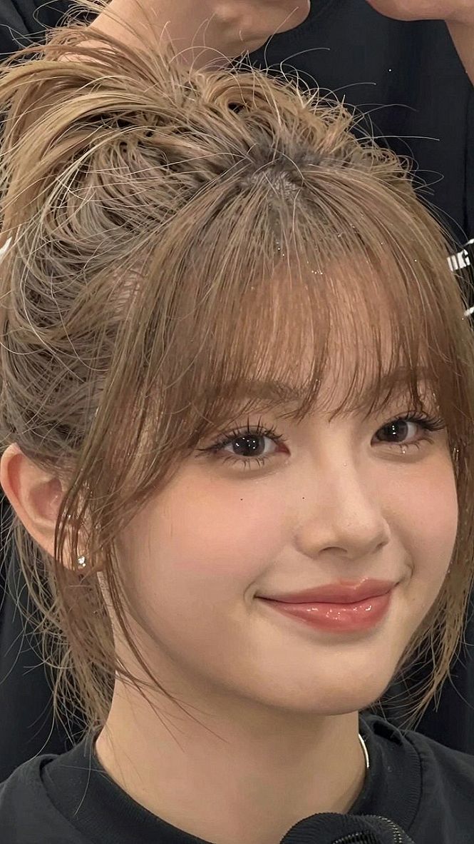 High Topknots Paired With Textured Bangs