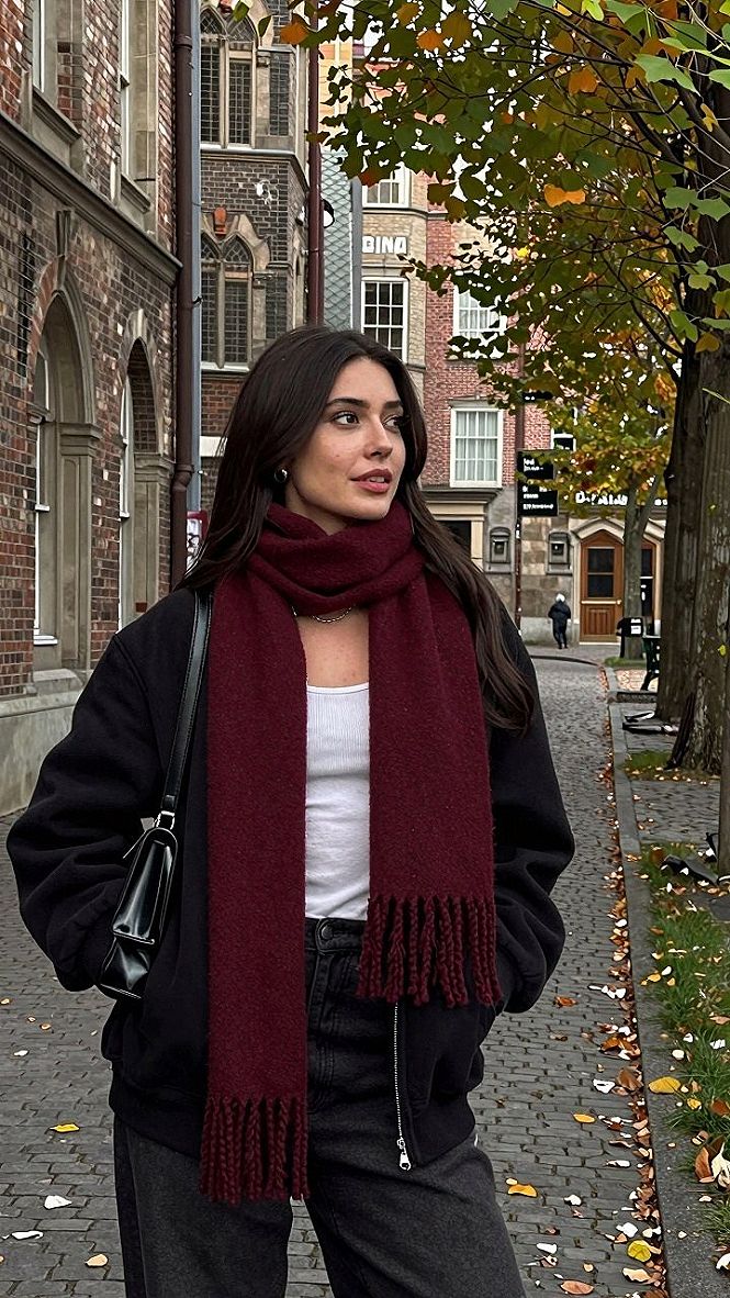 Adding a Deep Red Scarf to an Oversized Leather Jacket