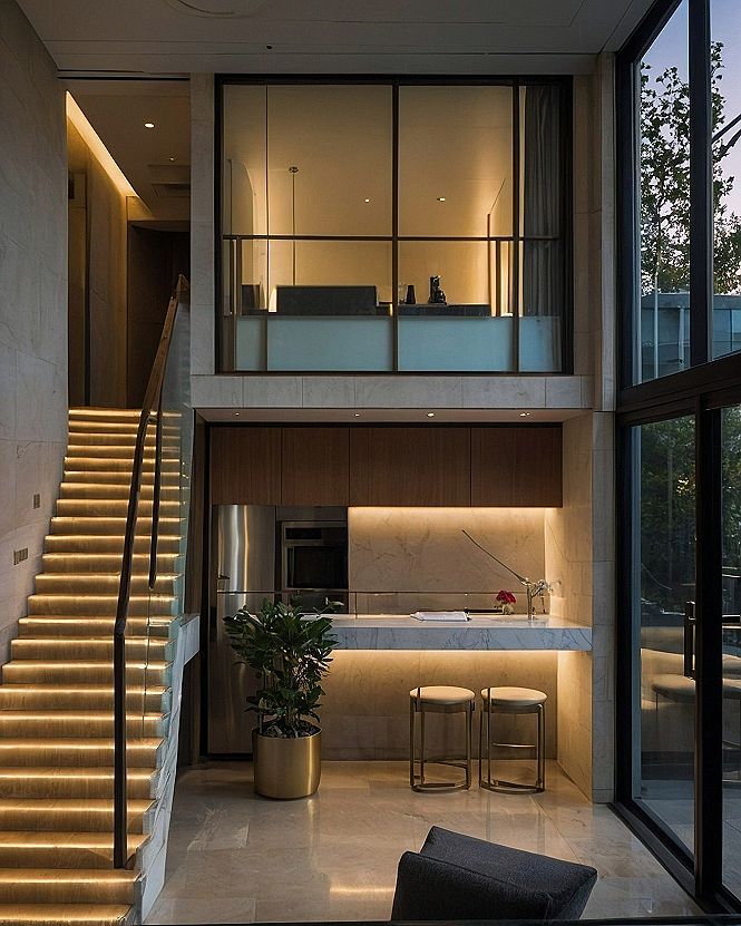 Illuminated Staircase and Chic Kitchenette