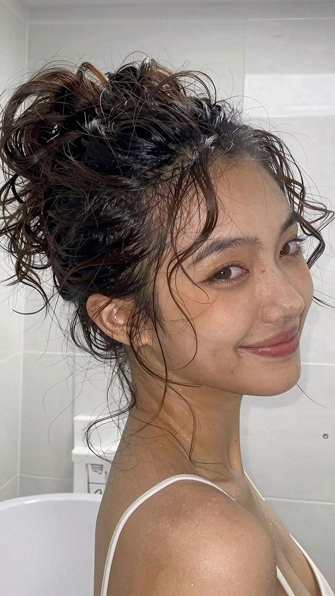 Securing a High Top Knot Bun for Long Hair