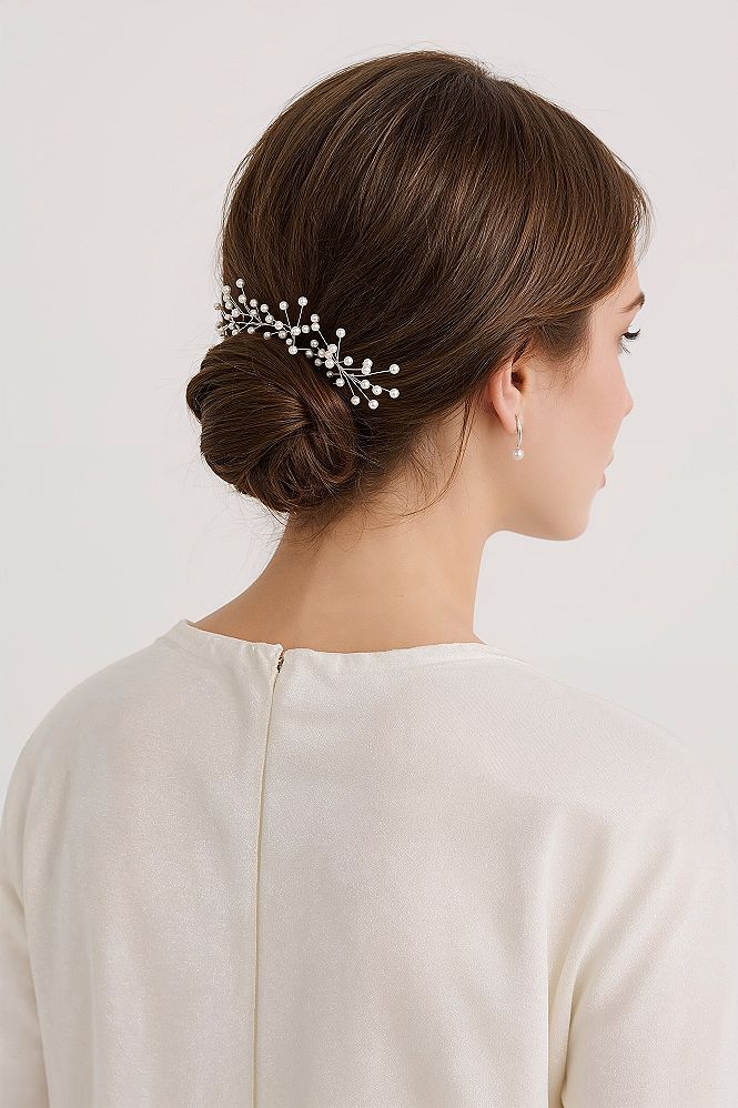 Bridal Hair Trends: Elegant Low Updo with Pearl Accessories