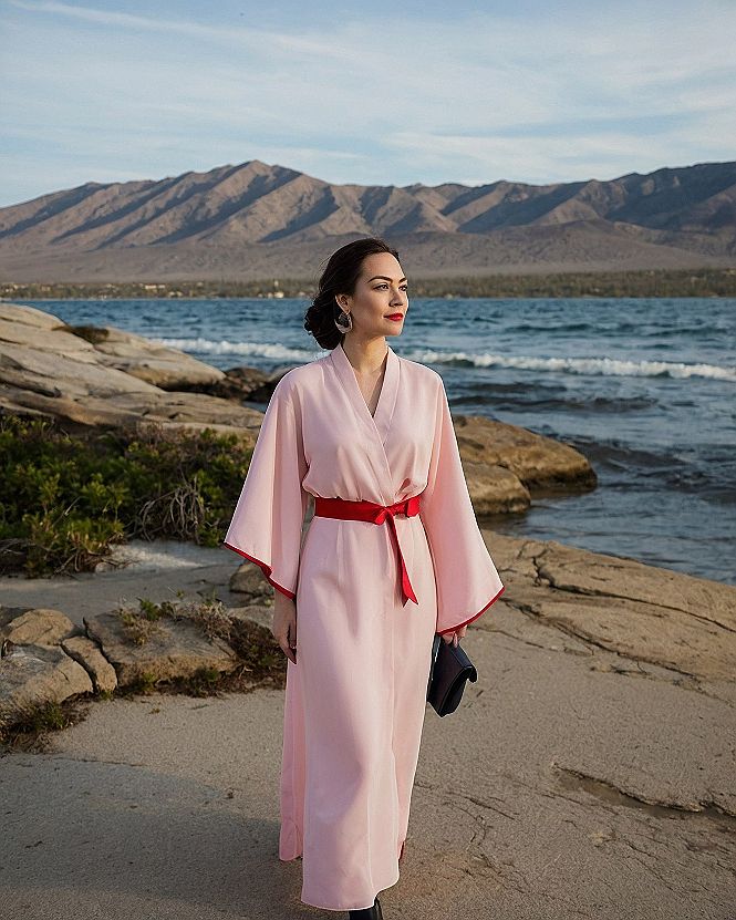 Embracing the Flowing Cape Sleeve Pink Gown