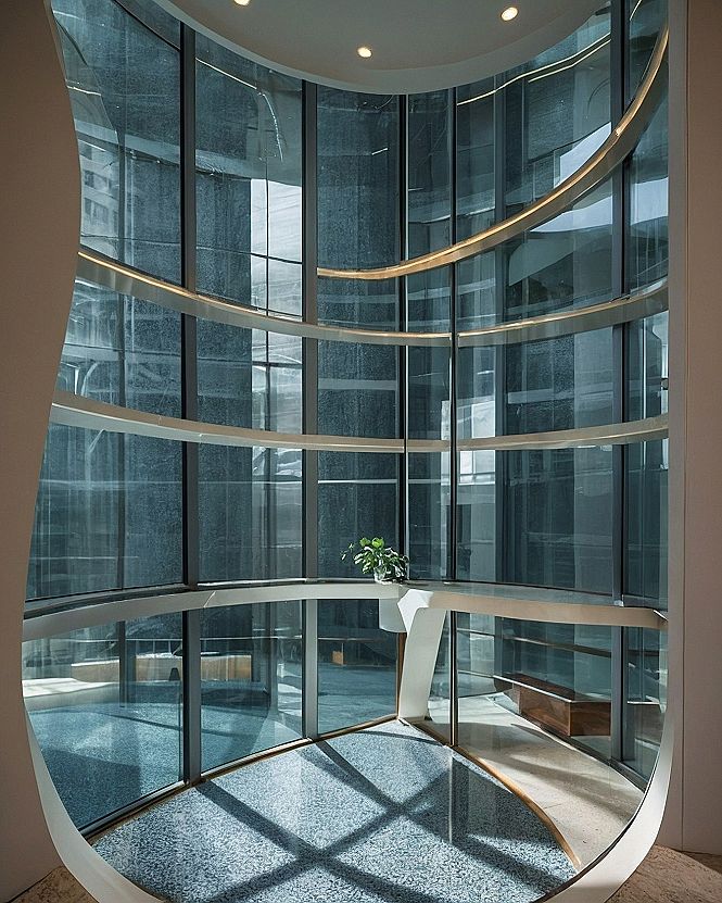 Adding a Dramatic Curved Glass Atrium to Your Home