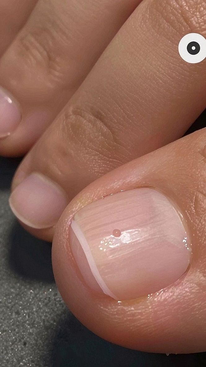 Adding A Fine Red French Tip To Your Pedicure