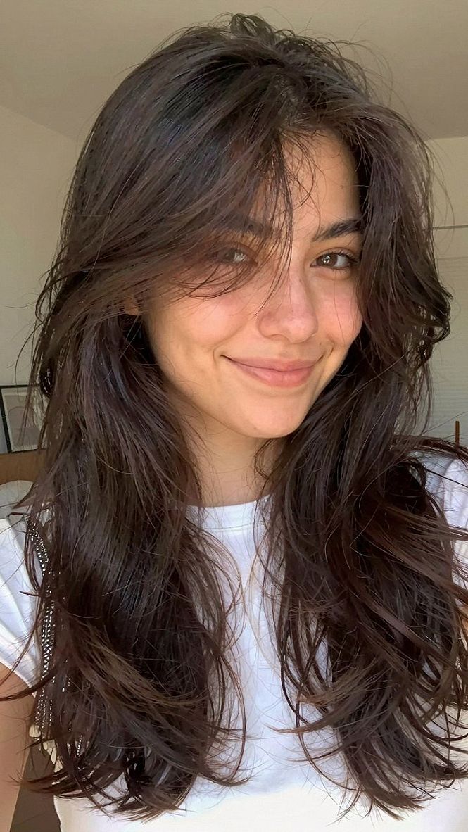 Styling Wavy Tresses With Piecey Bangs
