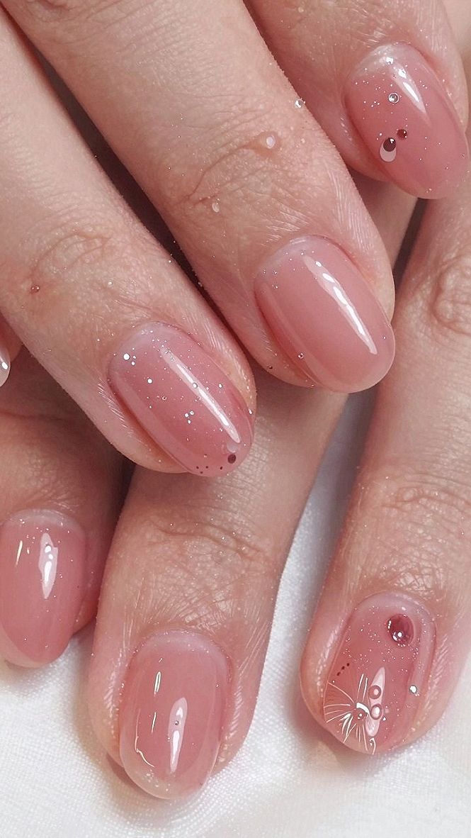 Adding Subtle Sparkle and Rhinestone Details to Warm Rose Nails